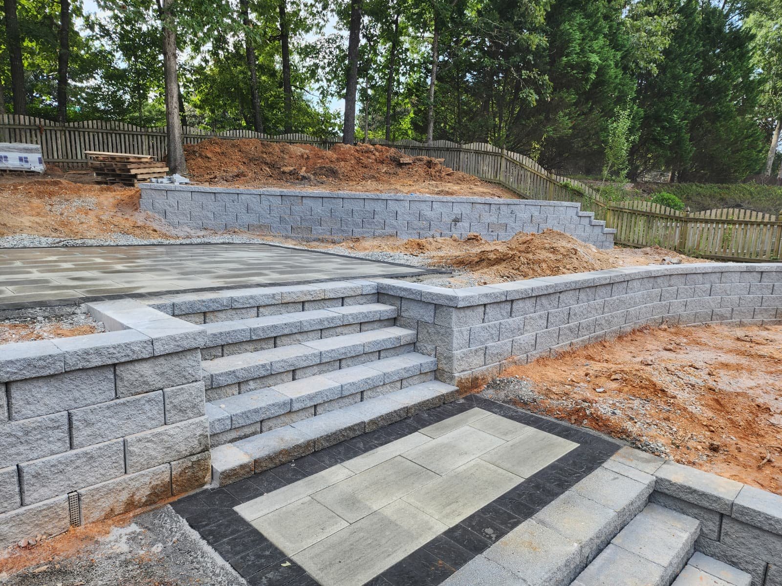 Stone patio and retaining wall landscaping project
